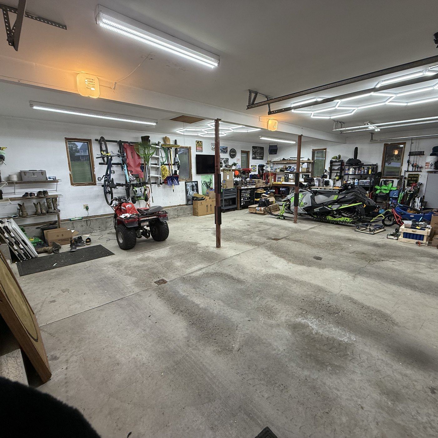 The shop, wide from the door, lights on