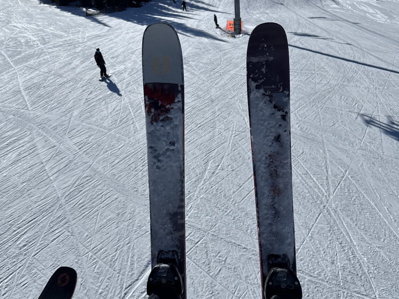 Skis on the slope, chairlift overhead